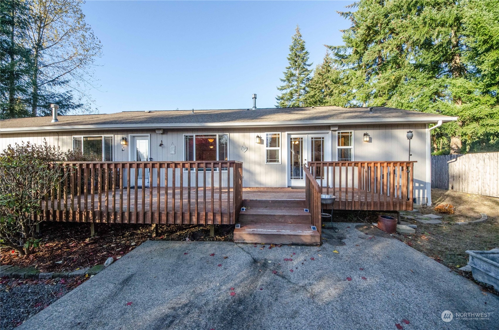 8203 177th Lane Southwest Rochester, WA 98579 - Photo 27 of 30 a view of a house with a backyard