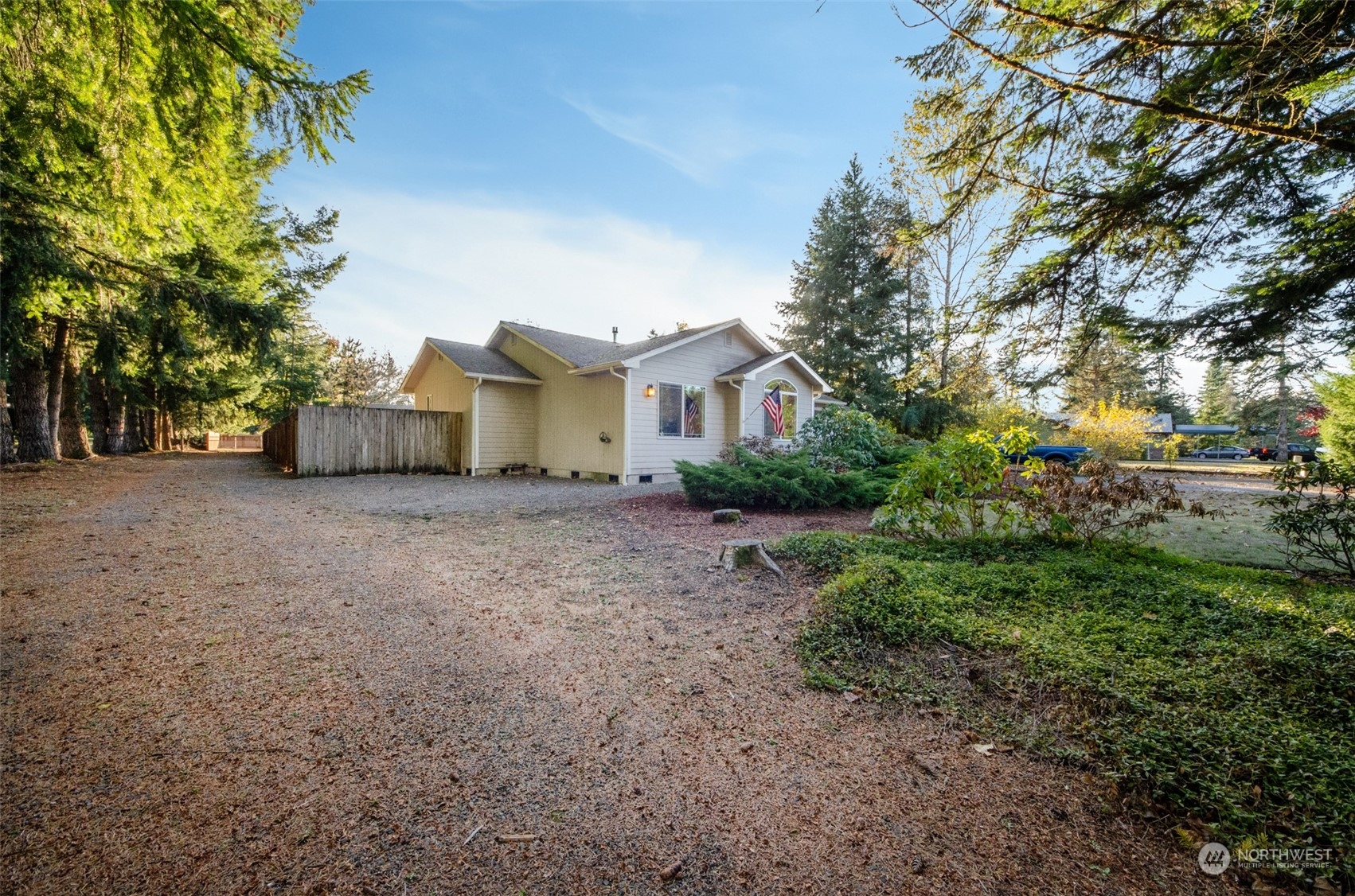 8203 177th Lane Southwest Rochester, WA 98579 - Photo 28 of 30 a view of a house with a tree in the background