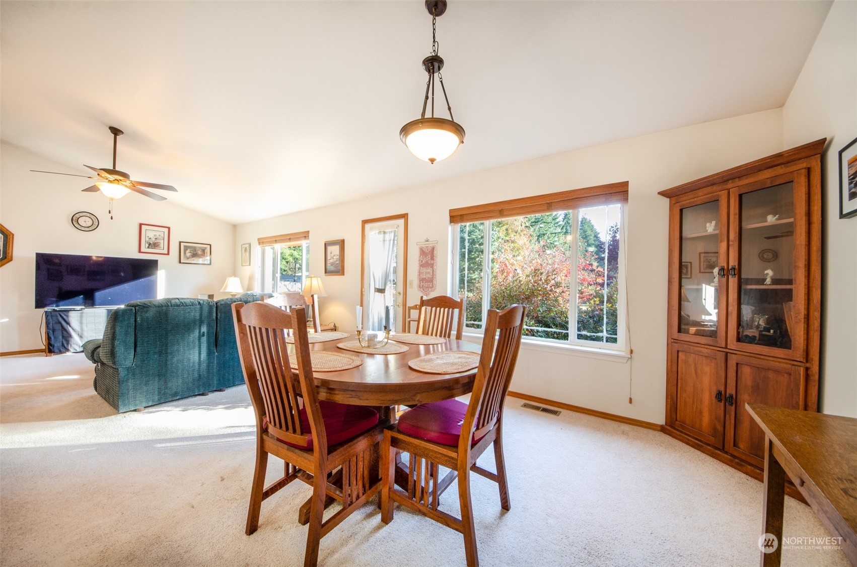 8203 177th Lane Southwest Rochester, WA 98579 - Photo 5 of 30 a view of a dining room with furniture large window and wooden floor