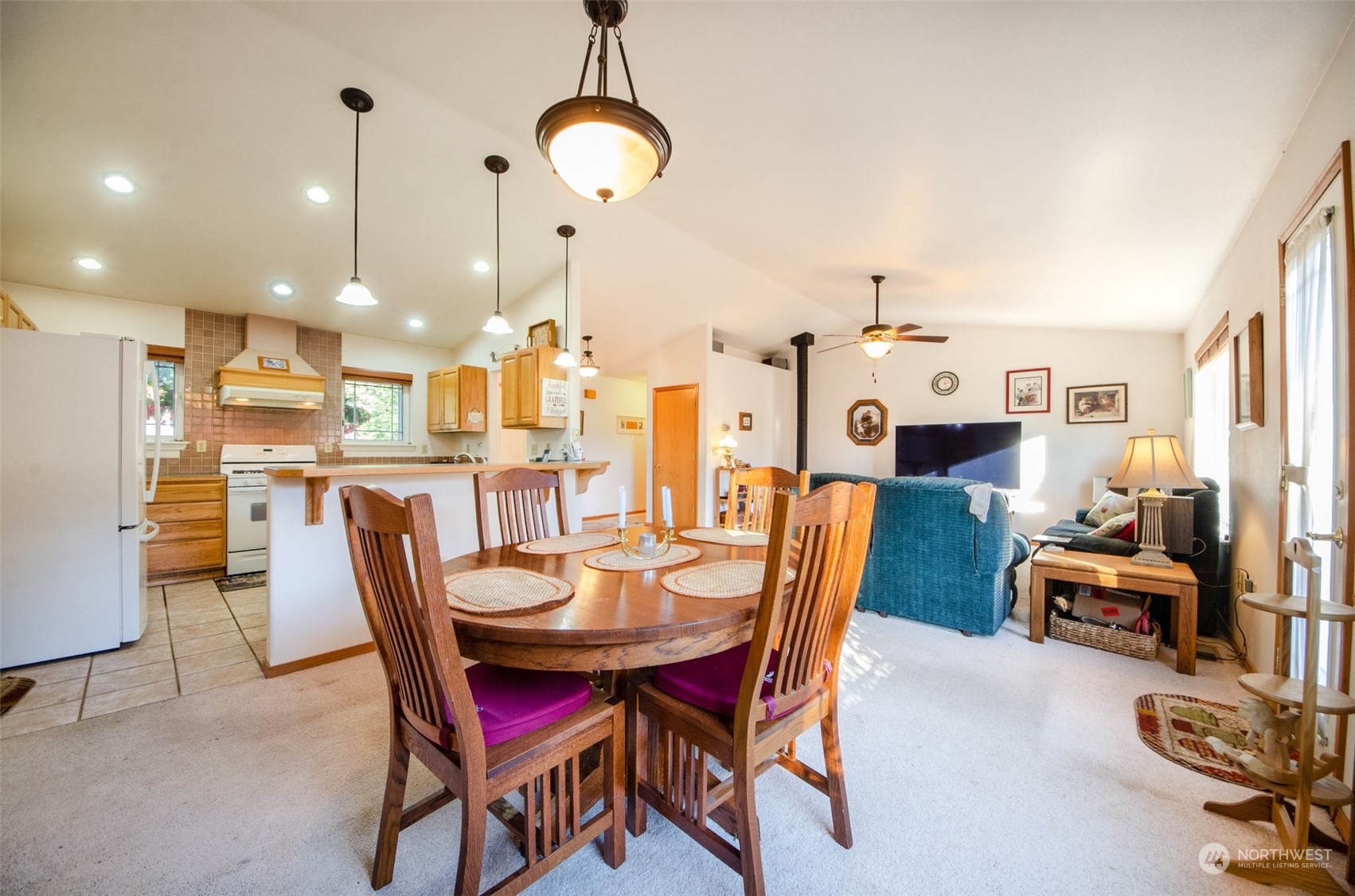 8203 177th Lane Southwest Rochester, WA 98579 - Photo 6 of 30 a dining room with furniture and a chandelier