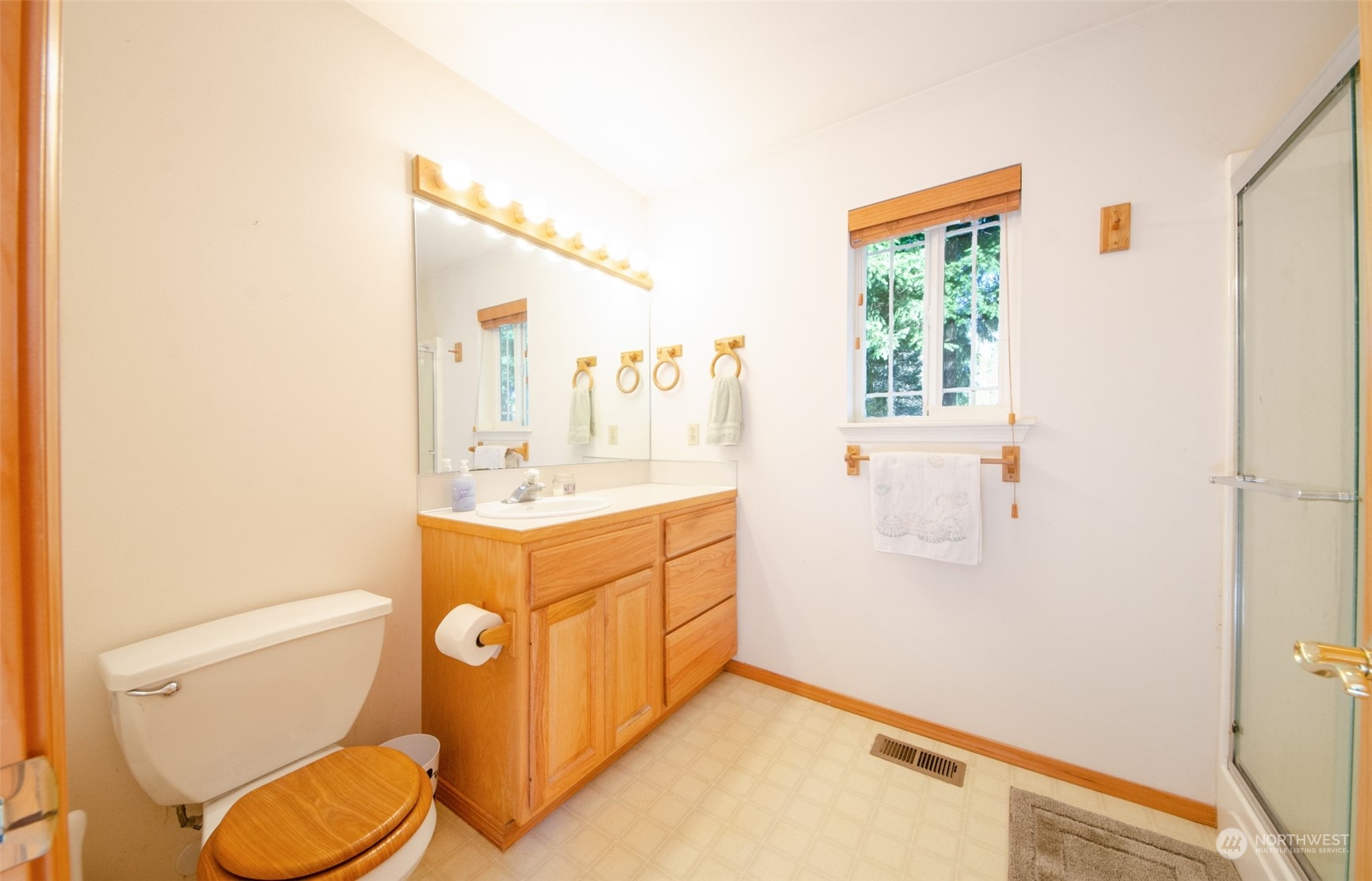 8203 177th Lane Southwest Rochester, WA 98579 - Photo 10 of 30 a bathroom with a toilet sink and mirror