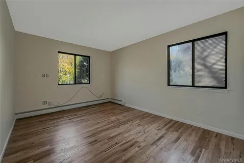 a bathroom with a shower a toilet and sink