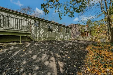 a view of balcony with wooden floor