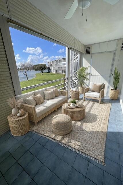 2075 Cornwall East, Unit 2075 Boca Raton, FL 33434 - Photo 22 of 32 a dining room with furniture and a floor to ceiling window