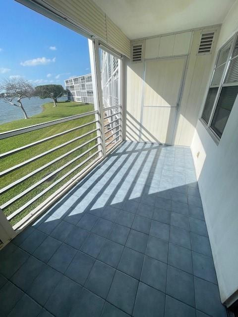 2075 Cornwall East, Unit 2075 Boca Raton, FL 33434 - Photo 23 of 32 a view of outdoor space with wooden floor and windows