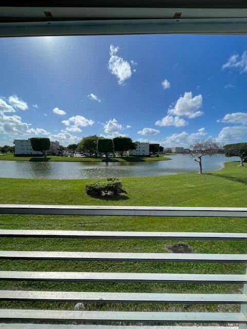 2075 Cornwall East, Unit 2075 Boca Raton, FL 33434 - Photo 28 of 32 a view of a golf course with a lake view