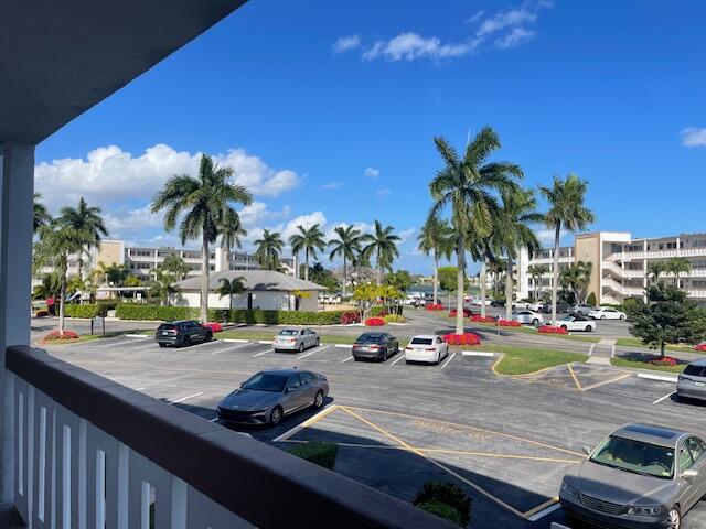 2075 Cornwall East, Unit 2075 Boca Raton, FL 33434 - Photo 30 of 32 a view of a swimming pool with lounge chairs