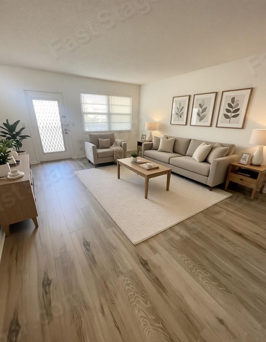 2075 Cornwall East, Unit 2075 Boca Raton, FL 33434 - Photo 7 of 32 a living room with furniture and wooden floor