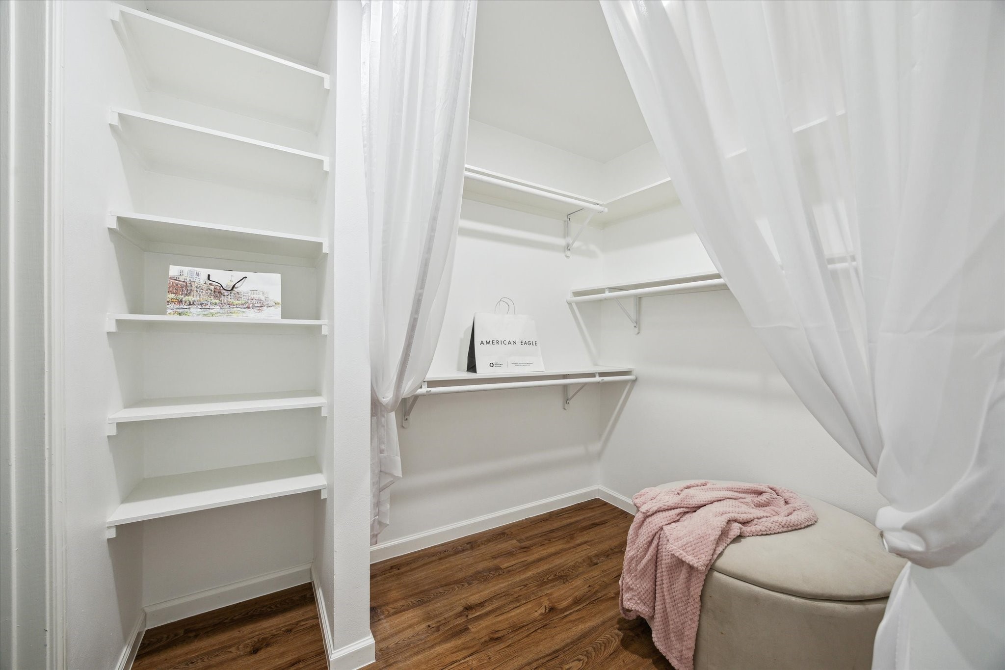 2231 Lexford Lane Houston, TX 77080 - Photo 17 of 23 a view of walk in closet with empty racks