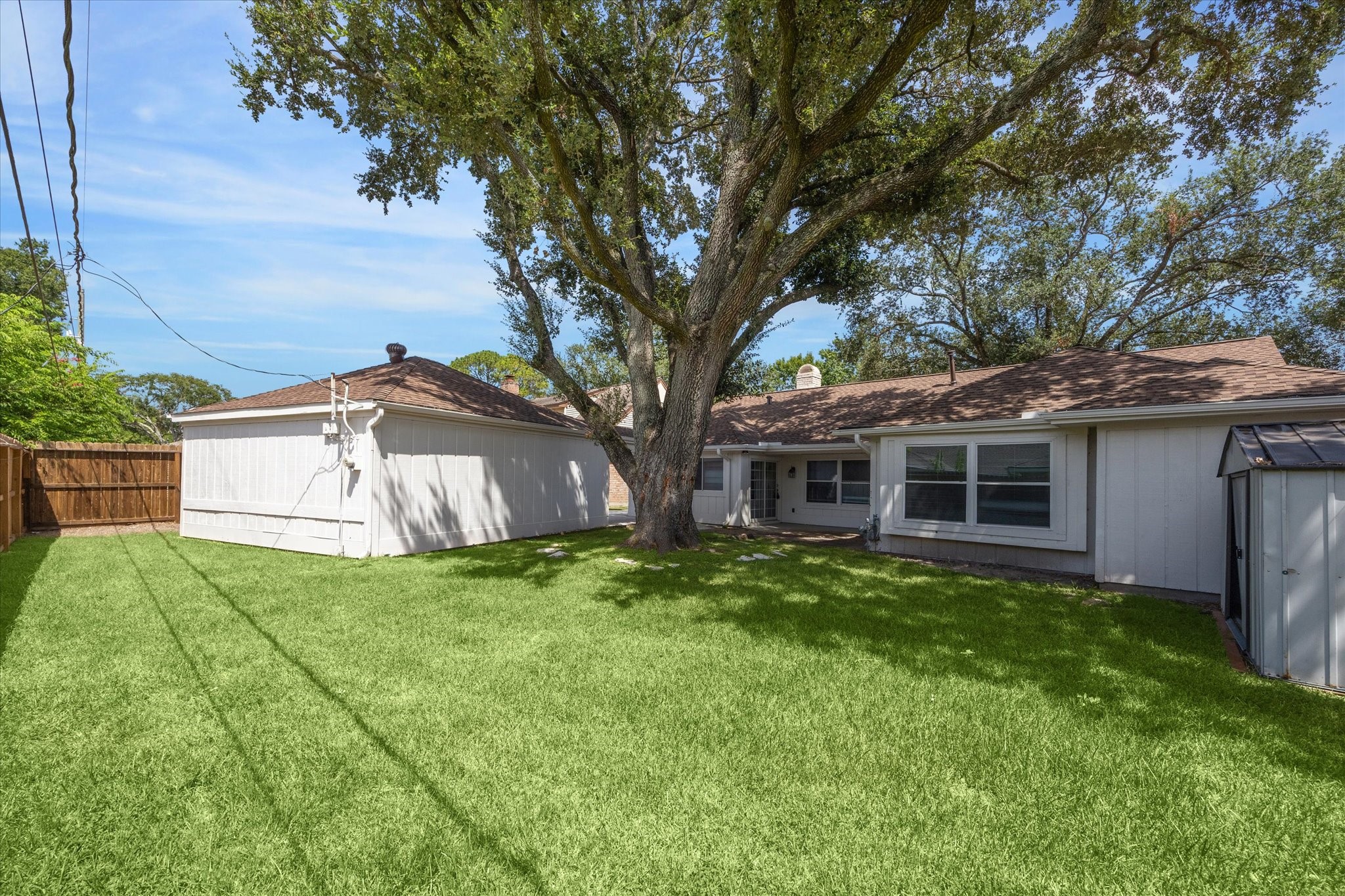 2231 Lexford Lane Houston, TX 77080 - Photo 23 of 23 a white house that has a tree in front of it