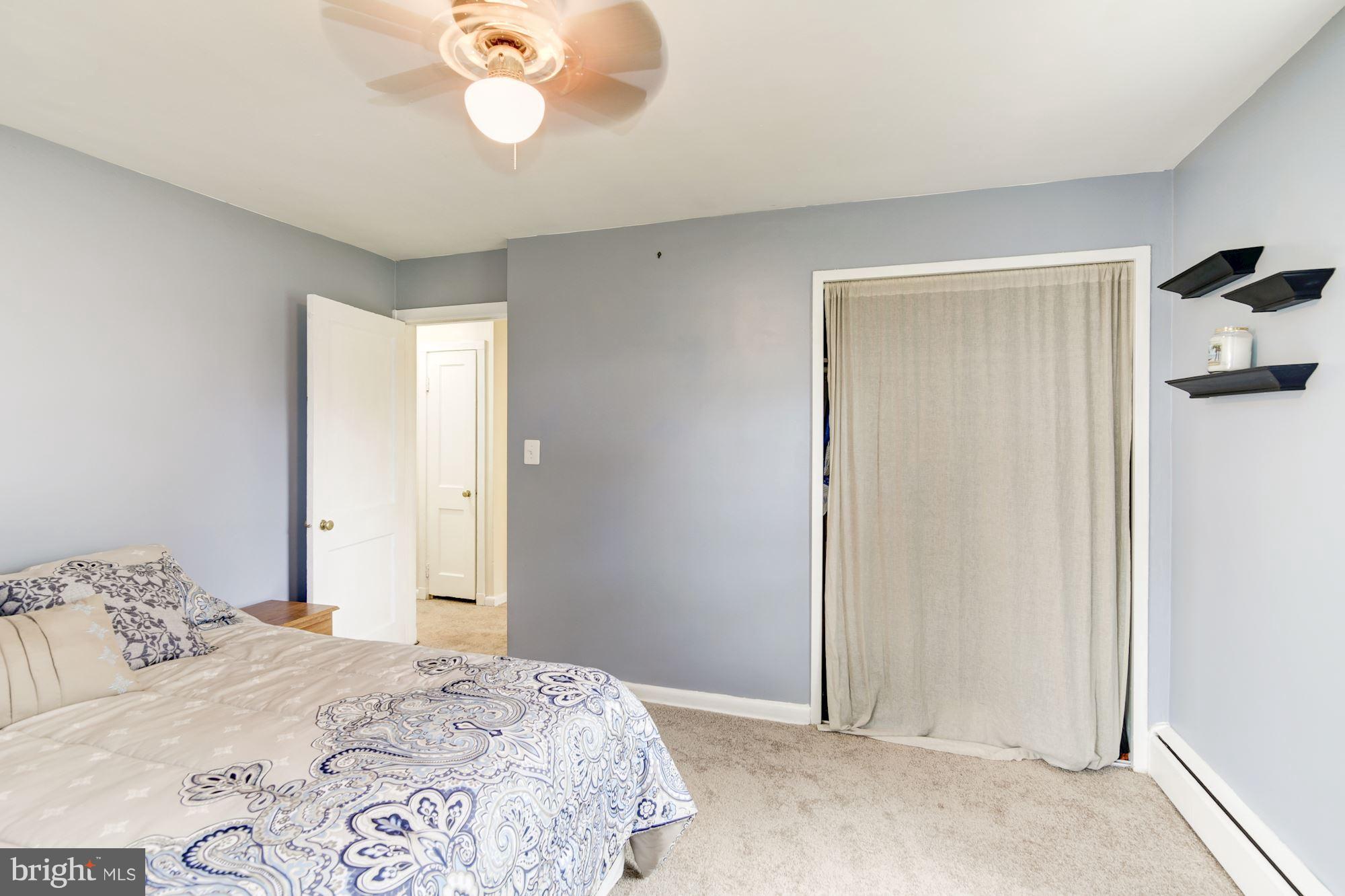 707 Silver Creek Road Baltimore, MD 21208 - Photo 14 of 30 a bedroom with a bed and a window