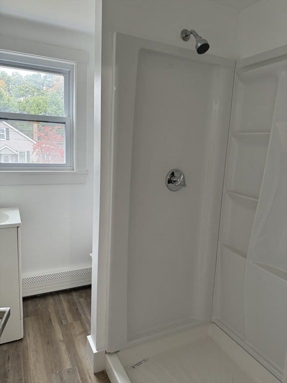 1099 South Main Street Bellingham, MA 02019 - Photo 20 of 20 a bathroom with a window and a shower