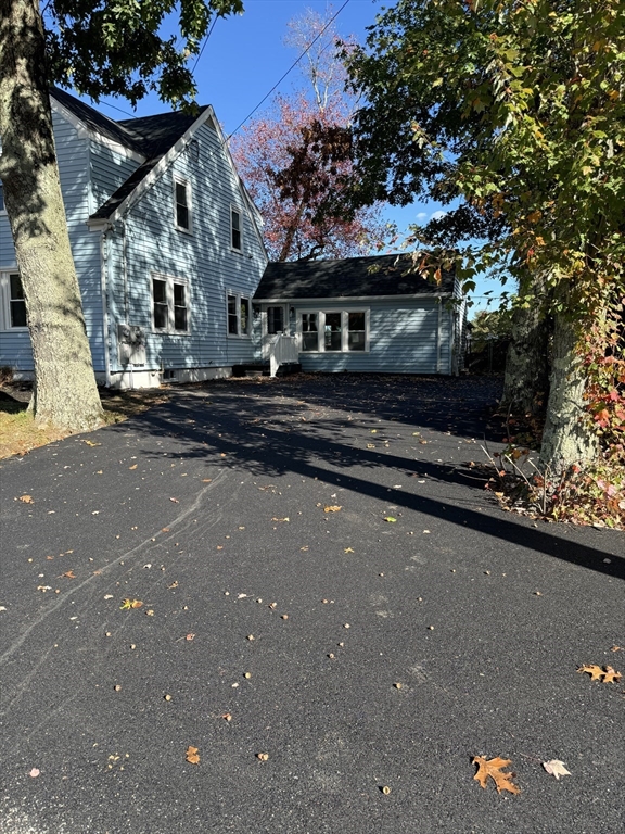 1099 South Main Street Bellingham, MA 02019 - Photo 3 of 20 a view of a street with houses