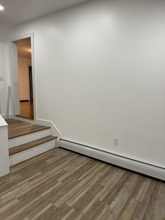 1099 South Main Street Bellingham, MA 02019 - Photo 7 of 20 a view of a room with wooden floor and bench