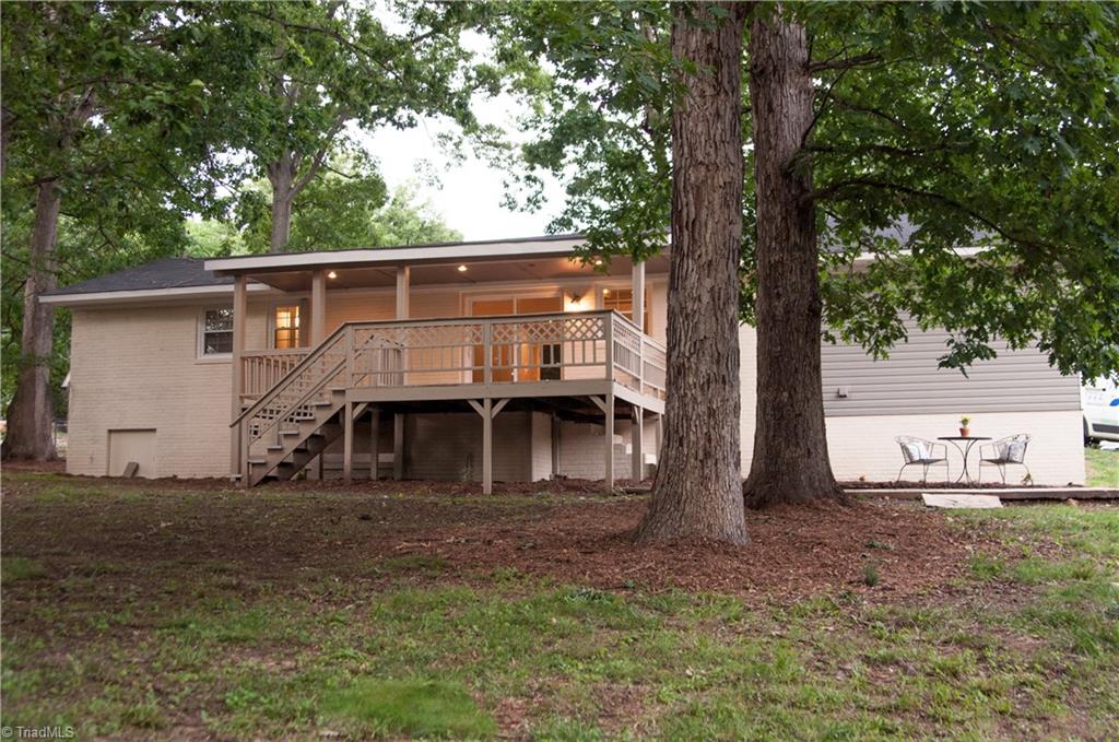 2995 Dillon Road Jamestown, NC 27282 - Photo 29 of 30 Large fenced in backyard with deck and patio area sits on just under half an acre.