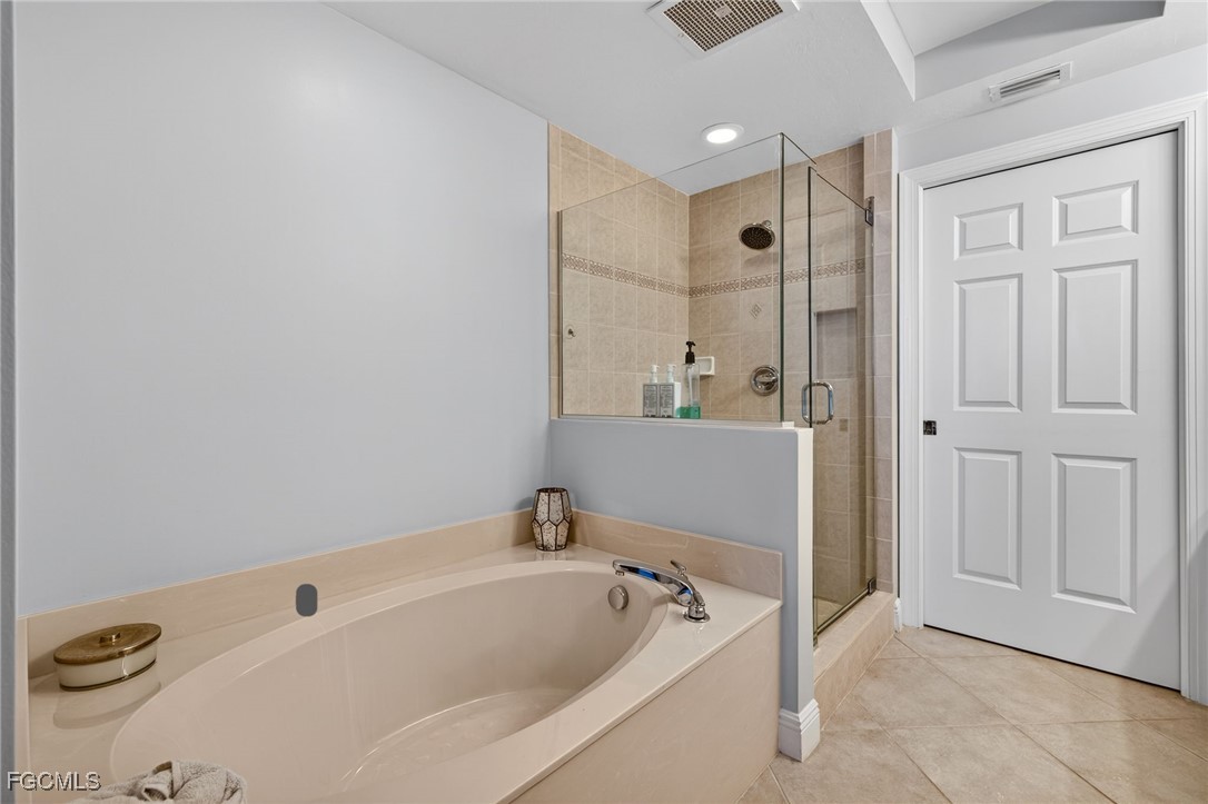 2743 First Street, Unit 502 Fort Myers, FL 33916 - Photo 16 of 39 a bathroom with a bathtub and a sink
