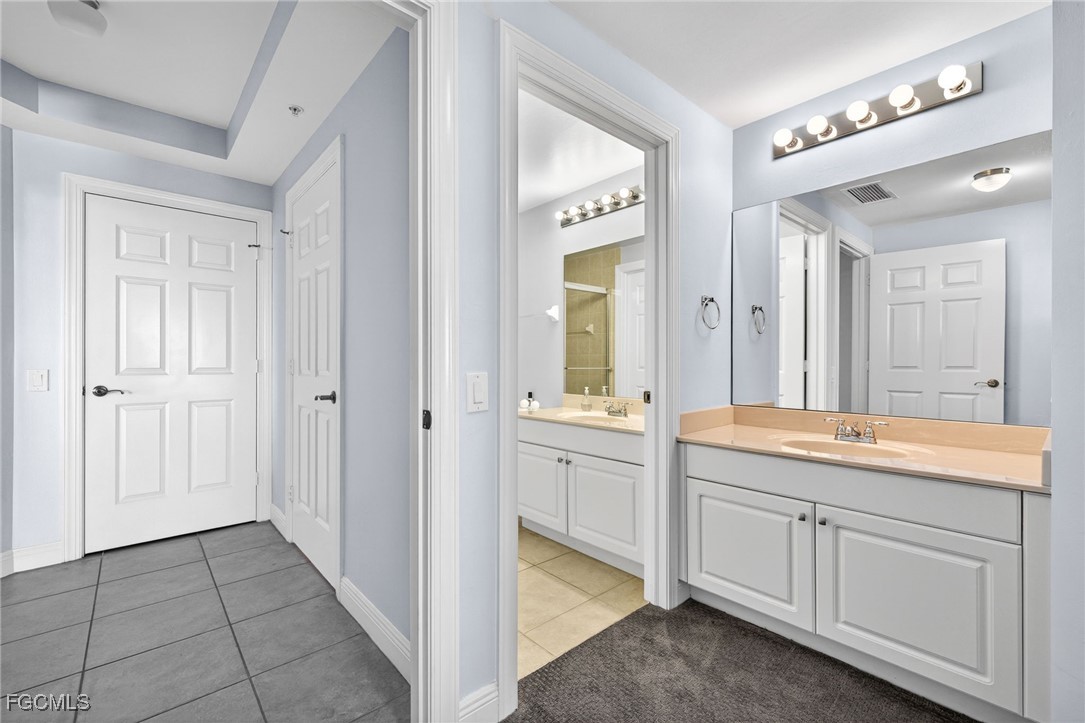 2743 First Street, Unit 502 Fort Myers, FL 33916 - Photo 22 of 39 a spacious bathroom with a granite countertop sink mirror and a