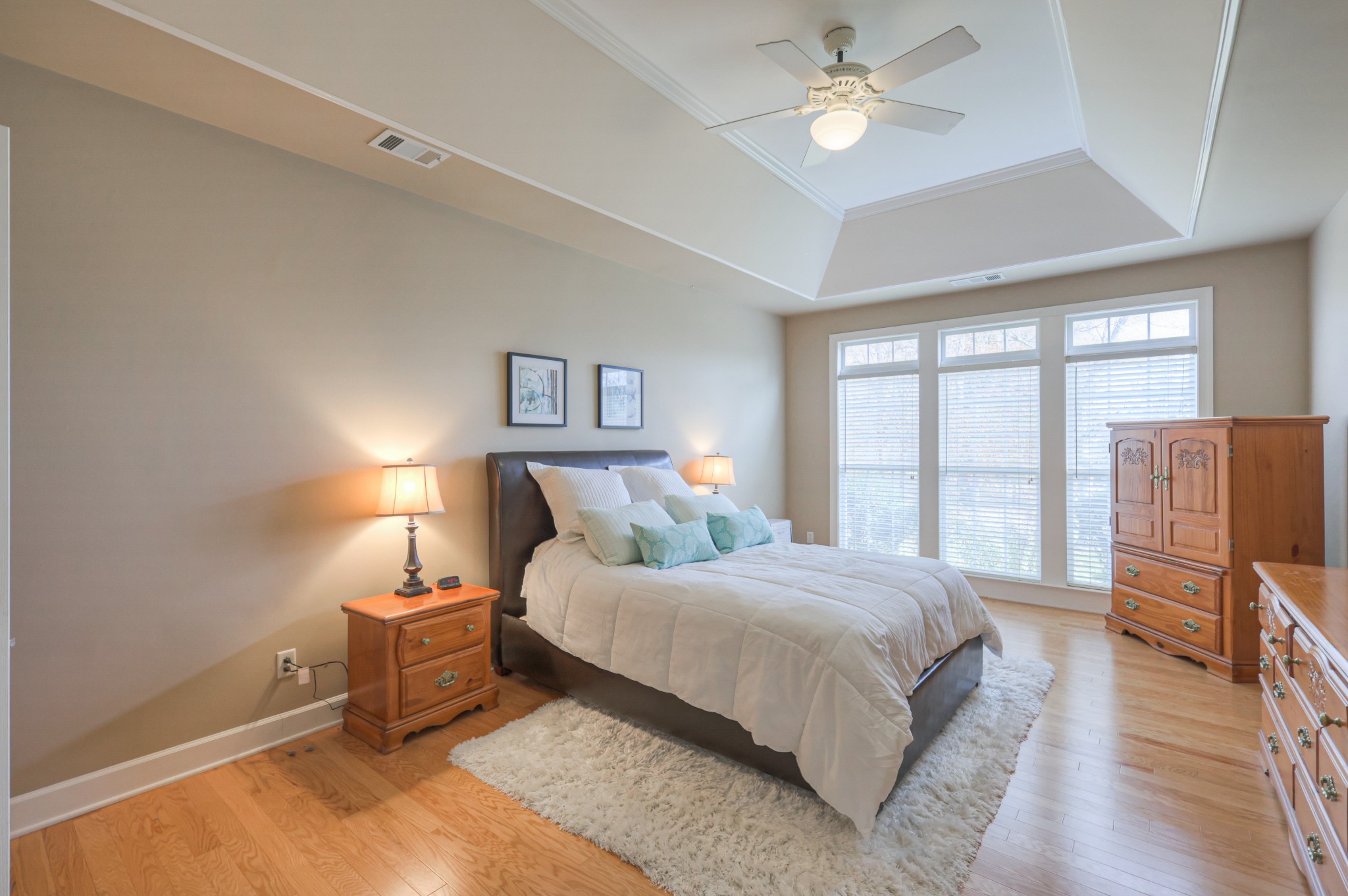 6331 Williams Grove Drive Brentwood, TN 37027 - Photo 12 of 58 a bedroom with a bed and a chandelier