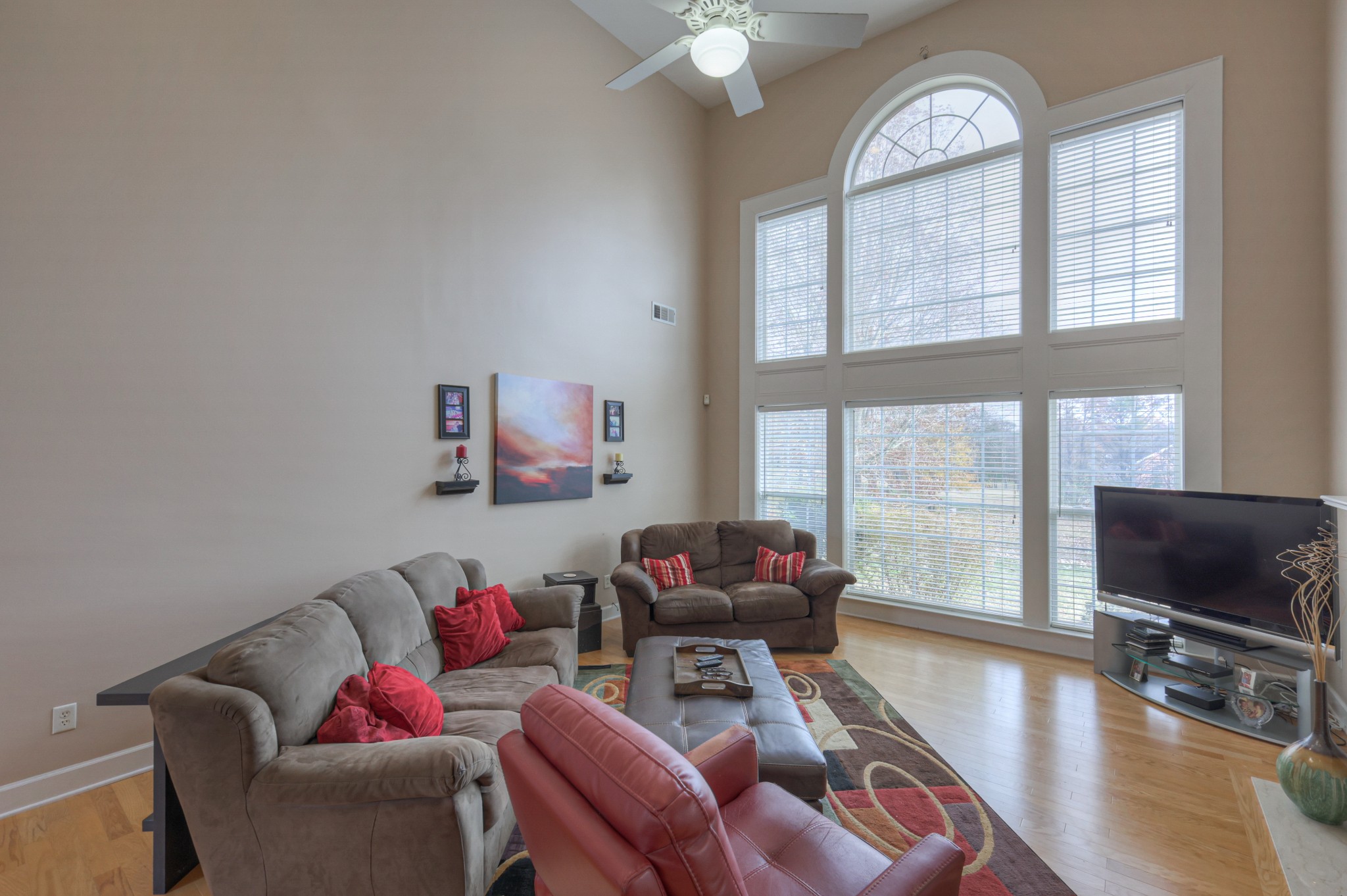 6331 Williams Grove Drive Brentwood, TN 37027 - Photo 19 of 58 a living room with furniture a flat screen tv and a large window