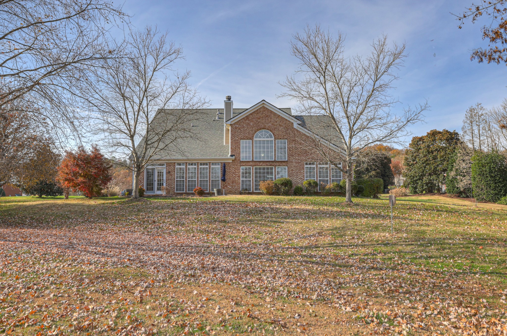6331 Williams Grove Drive Brentwood, TN 37027 - Photo 2 of 58 a big house with a big yard and large trees