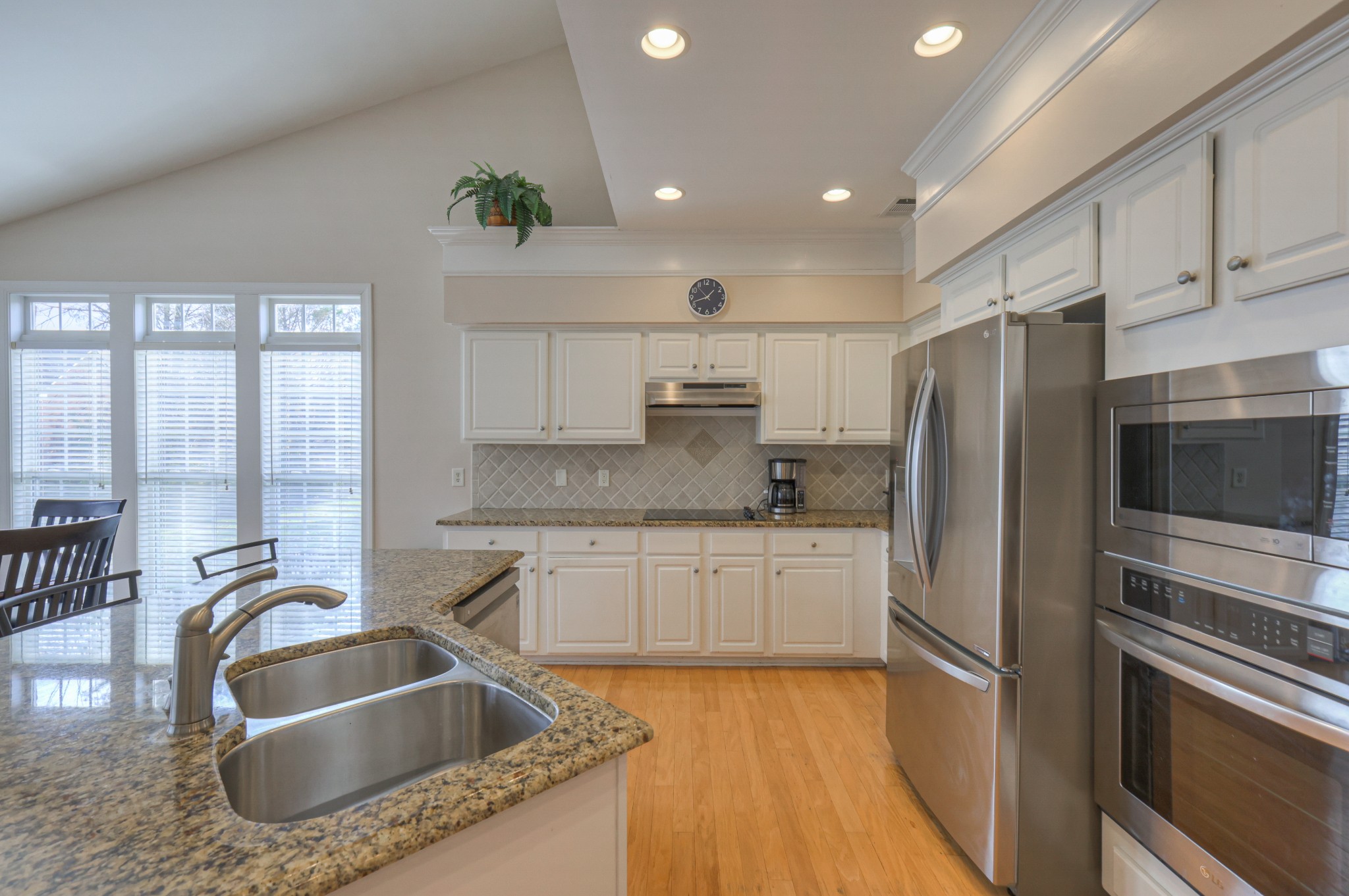 6331 Williams Grove Drive Brentwood, TN 37027 - Photo 3 of 58 a kitchen with kitchen island granite countertop a sink stainless steel appliances and cabinets