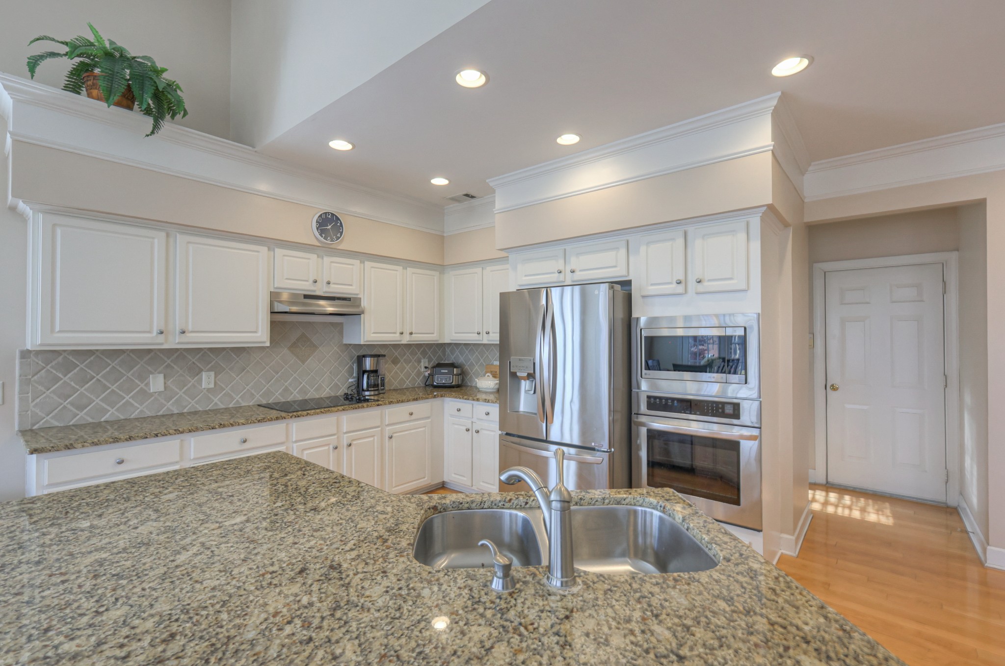 6331 Williams Grove Drive Brentwood, TN 37027 - Photo 6 of 58 a kitchen with stainless steel appliances granite countertop a refrigerator and a sink