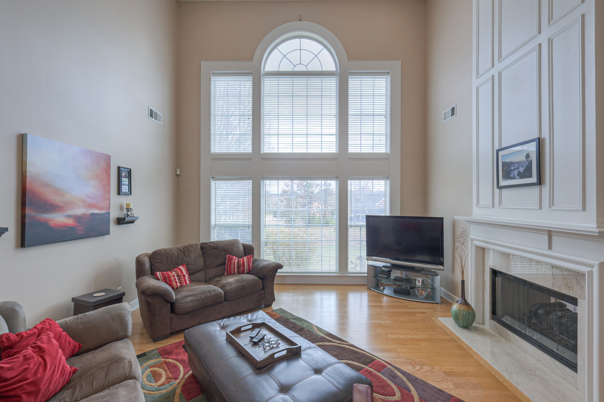 6331 Williams Grove Drive Brentwood, TN 37027 - Photo 7 of 58 a living room with furniture a fireplace and a flat screen tv