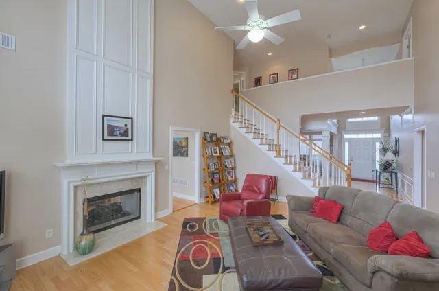 a living room with fireplace furniture and a flat screen tv