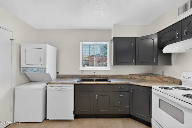 a view of a bathroom with a sink and mirror