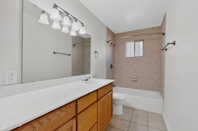 a view of room with wooden floor and ceiling fan