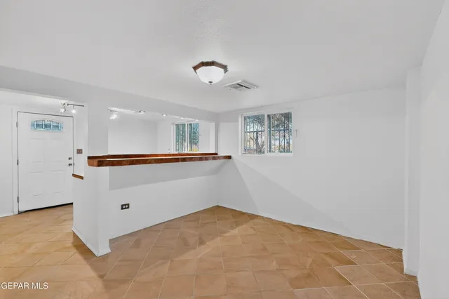 a kitchen with stainless steel appliances granite countertop a stove and a refrigerator