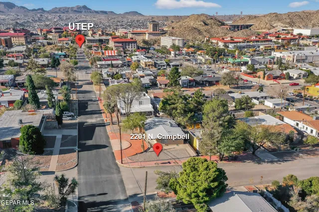 an aerial view of a city with lots of residential buildings