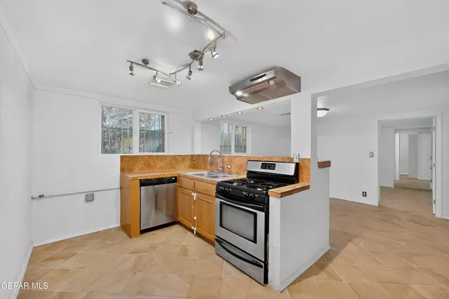 a view of an empty room with a window