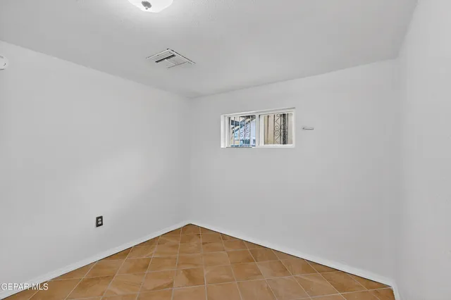 a view of a chandelier fan in a room