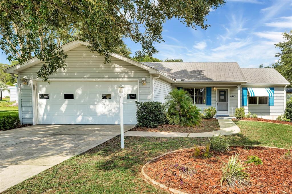 1613 Cherry Hill Road The Villages, FL 32159 - Photo 1 of 1 a view of a house with backyard and sitting area
