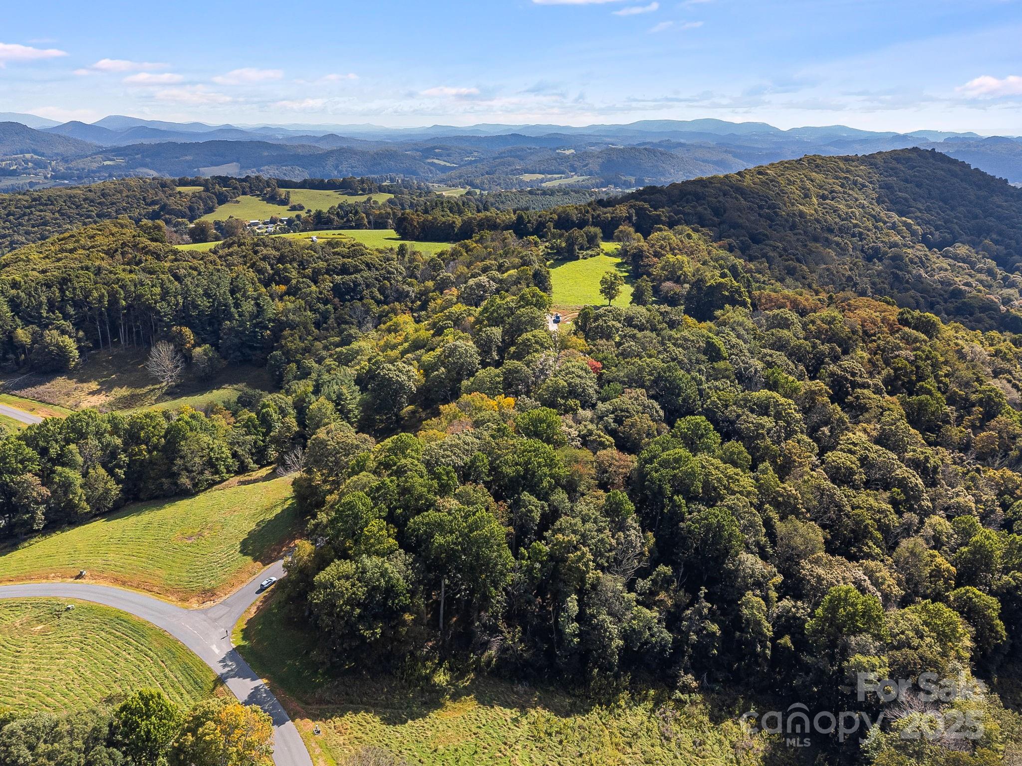 62 Poplar Forest Drive Boone, NC 28607 - Photo 25 of 27 a view of a city with mountains in the background