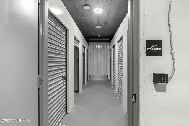 a view of hallway with stairs and a hallway