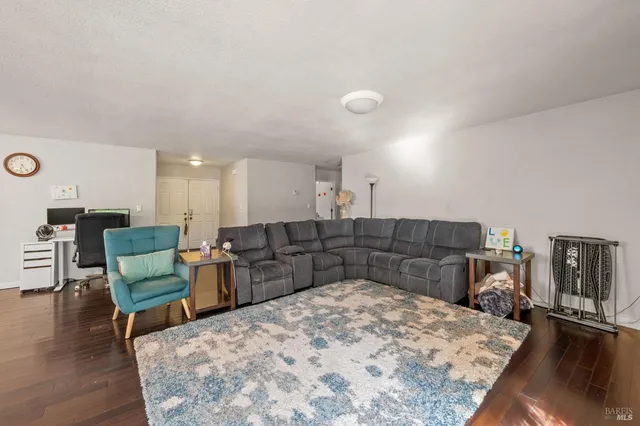 a kitchen with stainless steel appliances granite countertop a stove and wooden floor
