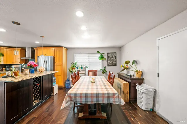 a kitchen with a table and chairs in it