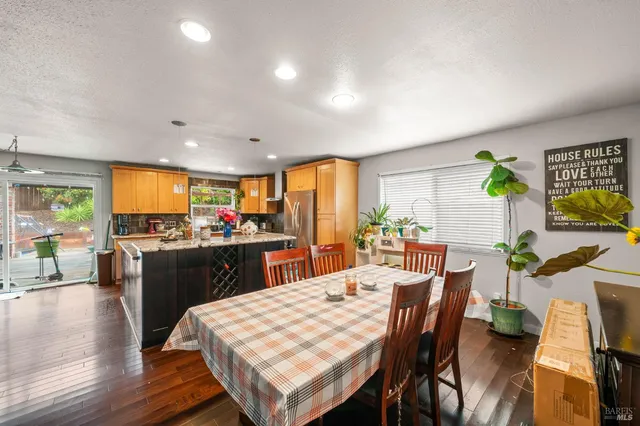 a kitchen with sink refrigerator and cabinets
