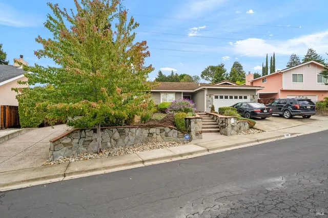 a city street lined with buildings and trees