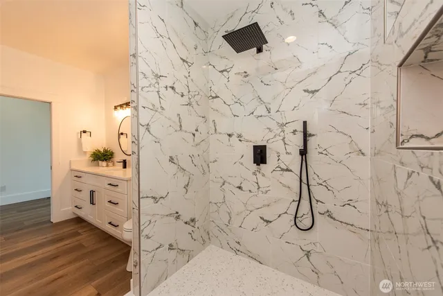 a bathroom with a bathtub and shower