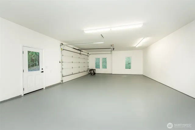an empty room with white walls