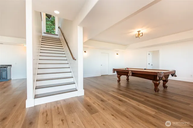 a room with wooden floor and furniture