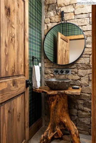 a bathroom with a sink and mirror