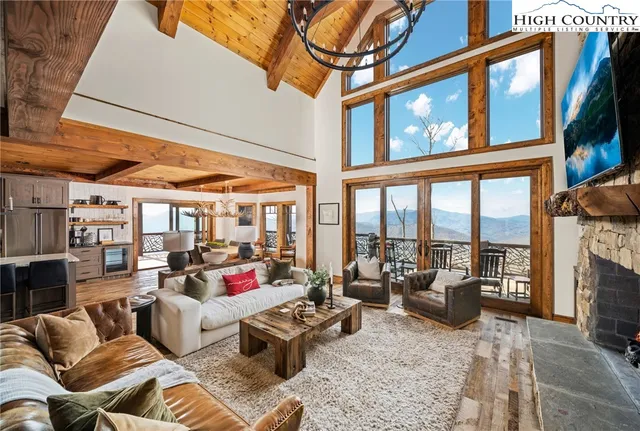 a living room with furniture or couch and a floor to ceiling window