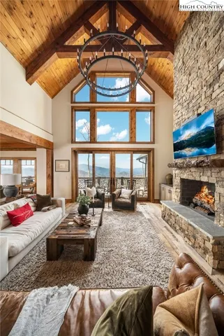 a living room with furniture fireplace and flat screen tv