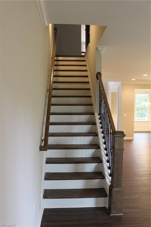 1728 Gerringer Mill Road Burlington, NC 27217 - Photo 12 of 28 Hardwood Stairs with Wrought Iron Rails