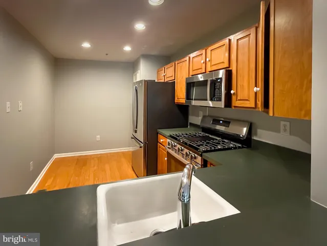 a kitchen with a stove and a refrigerator