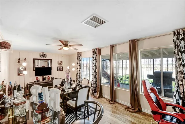 a view of a livingroom with furniture and a flat screen tv